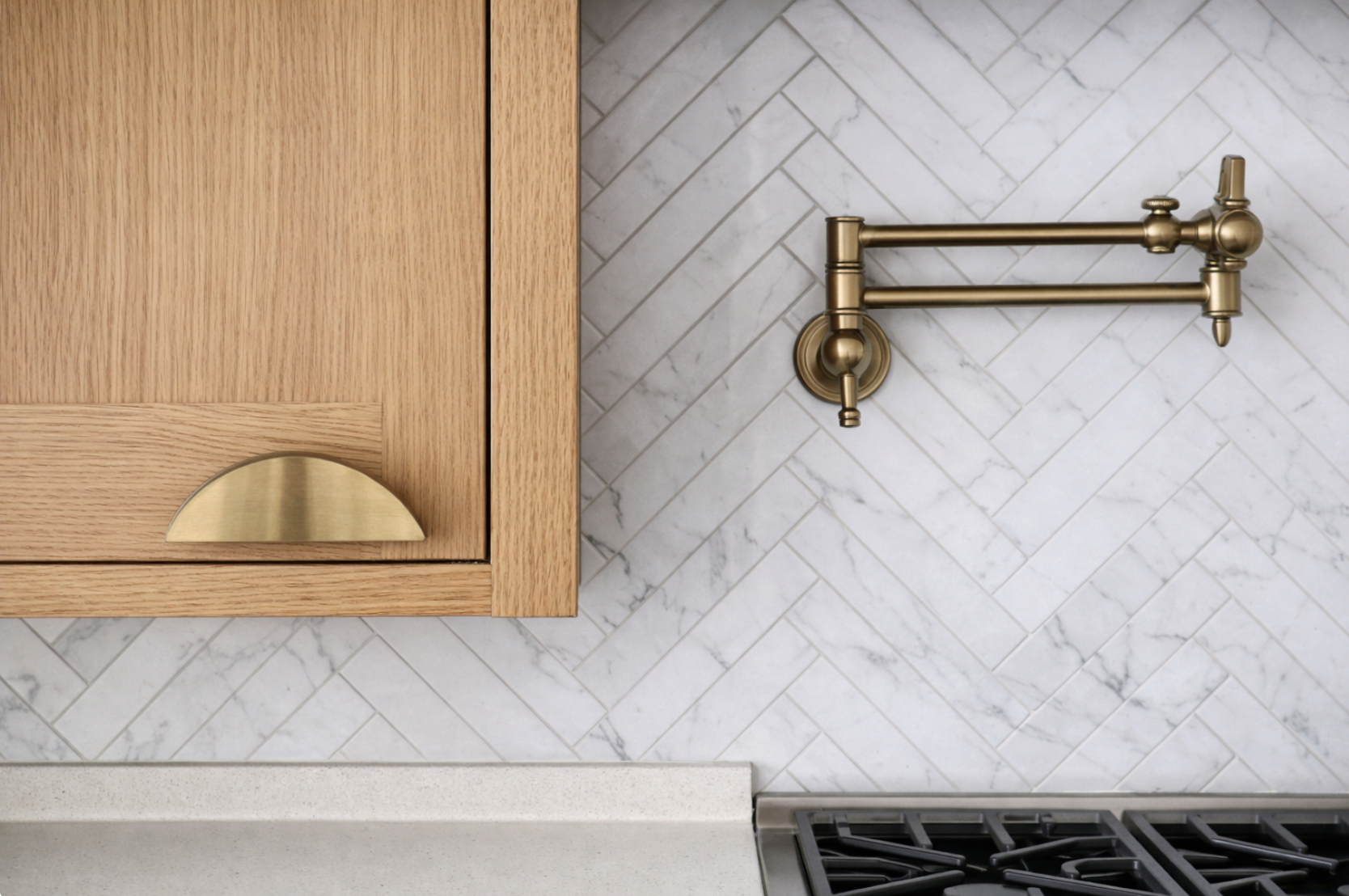Brass Pot Filler & Herringbone Backsplash